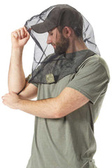 Man showing how to easily put on Bug Baffler insect protective headset.